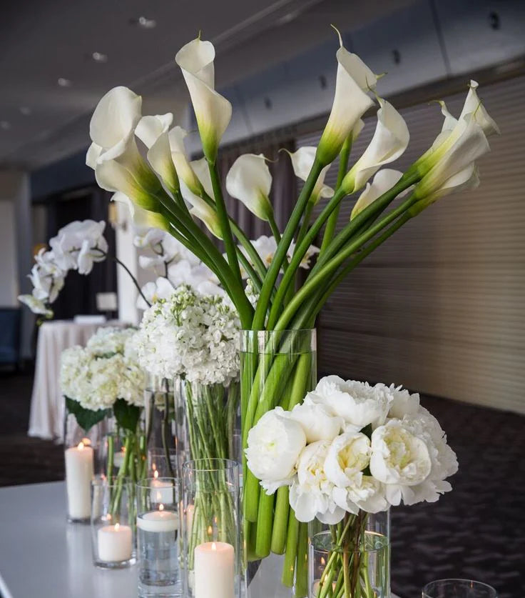 Lush floral centerpiece at an event table by Pink Clover