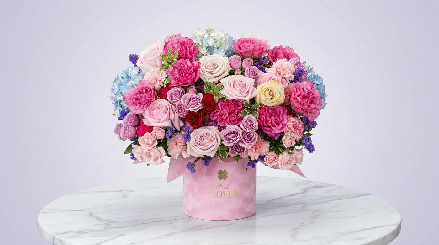 Glow — pink rose arrangement in a signature Pink Clover box
